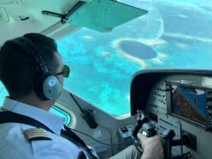 Tropic Air Pilot during Blue Hole Flyover Tour